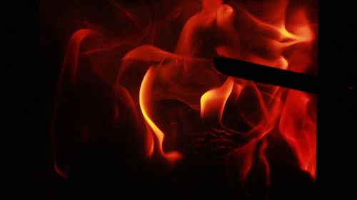 Close-up of fire in black background