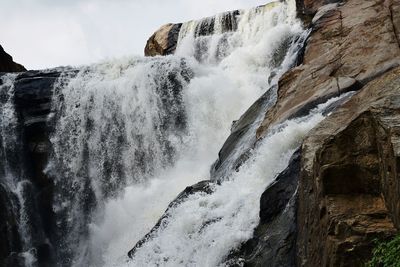 Close-up of waterfall against sky