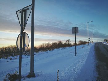 Snow covered field against sky