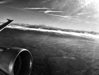 Airplane on runway against sky