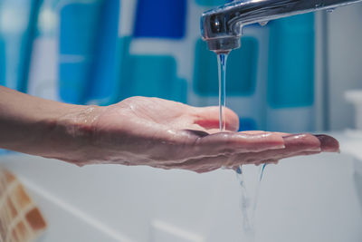 Close-up of hand on water