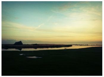 Scenic view of sea at sunset