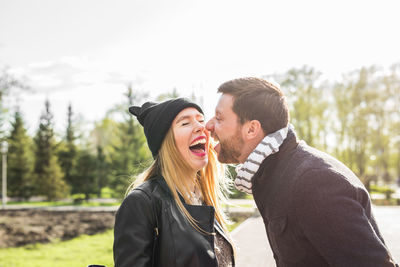 Young couple standing outdoors