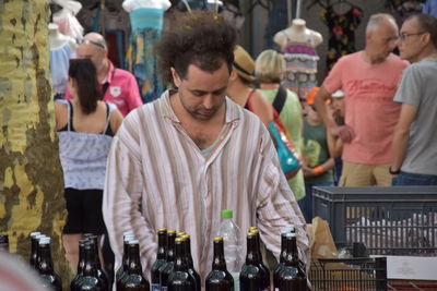 People standing at market stall