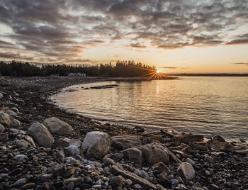 Sunrise over a beach on the rugged maine coast, acadia national park.