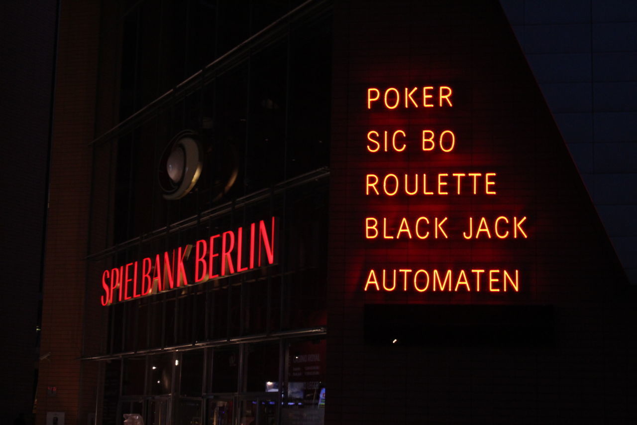 LOW ANGLE VIEW OF ILLUMINATED SIGN ON BUILDING