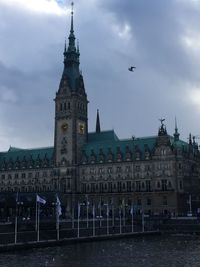 View of clock tower against sky in city