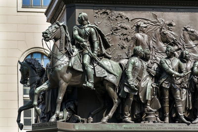 Low angle view of statues against historic building