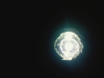 Low angle view of illuminated light bulb