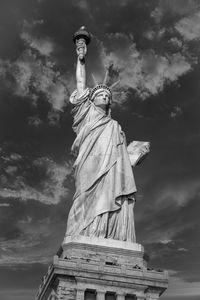 Low angle view of statue against cloudy sky