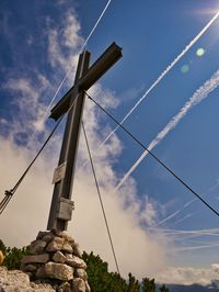 Low angle view of windmill against sky