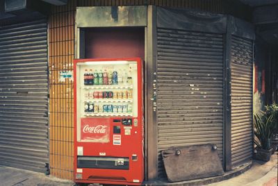 Text on closed shutter of store