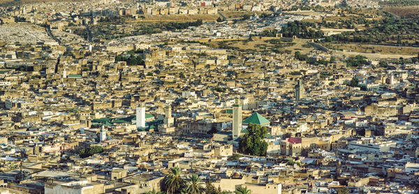 High angle shot of townscape against cityscape