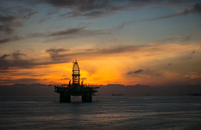A silhouette of the drilling semi submersible platform anchored in the brunei bay in the morning 