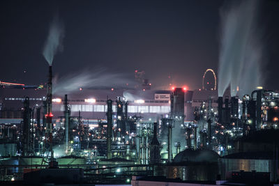 Illuminated buildings in city at night