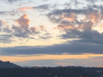 Scenic view of silhouette mountains against sky during sunset