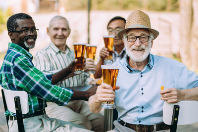 People in front of drinking glass