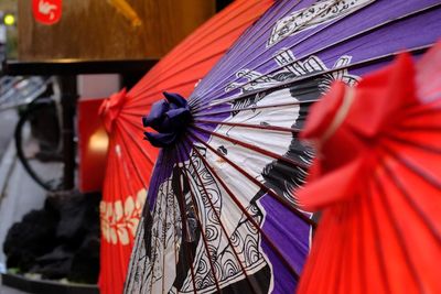 Close-up of multi colored umbrellas for sale