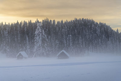 Scenic view of snow covered landscape against sky