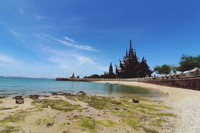 Panoramic view of beach against blue sky