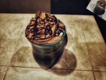 High angle view of coffee cup on table