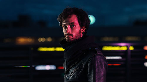 Portrait of young man standing outdoors