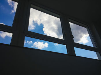 Low angle view of building against cloudy sky