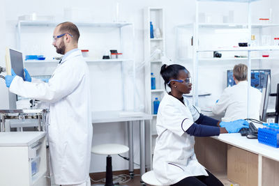 Scientist examining chemical in laboratory