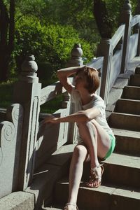 Boy sitting in park