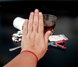 Close-up of hands holding glass