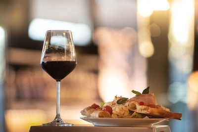 Close-up of wine in glass on table in restaurant