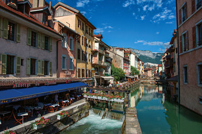 Facade of old and colorful buildings facing a canal at annecy., france.