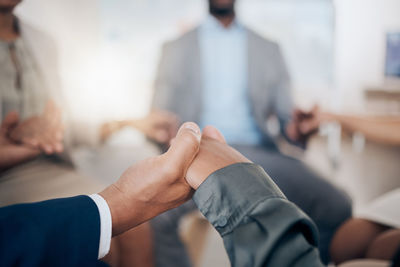 Close-up of business people shaking hands