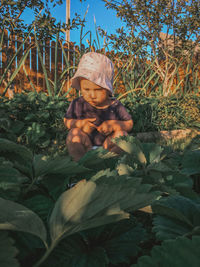 Portrait of boy with plants