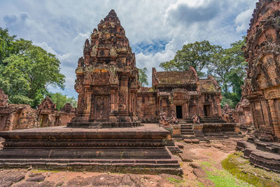 Old temple against cloudy sky