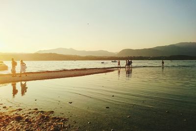 Scenic view of sea with mountain in background