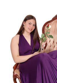 Portrait of a smiling young woman over white background