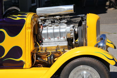 Close-up of yellow motorcycle