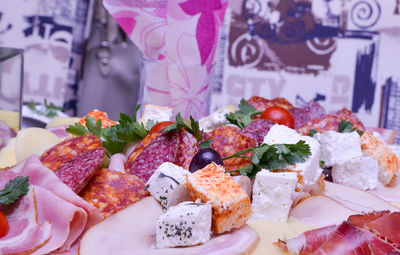 Close-up of man preparing food at market stall