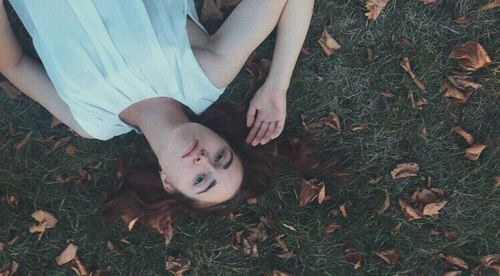 High angle view of man lying on field