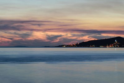 Scenic view of sea against sky at sunset