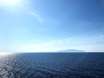 Scenic view of sea against blue sky