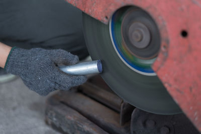 Close-up of man working on machine