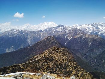 Scenic view of snowcapped mountains against sky