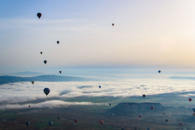 View of hot air balloons flying in sky