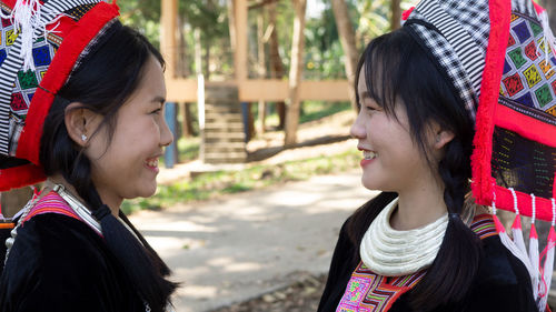 Portrait of a smiling young woman looking away