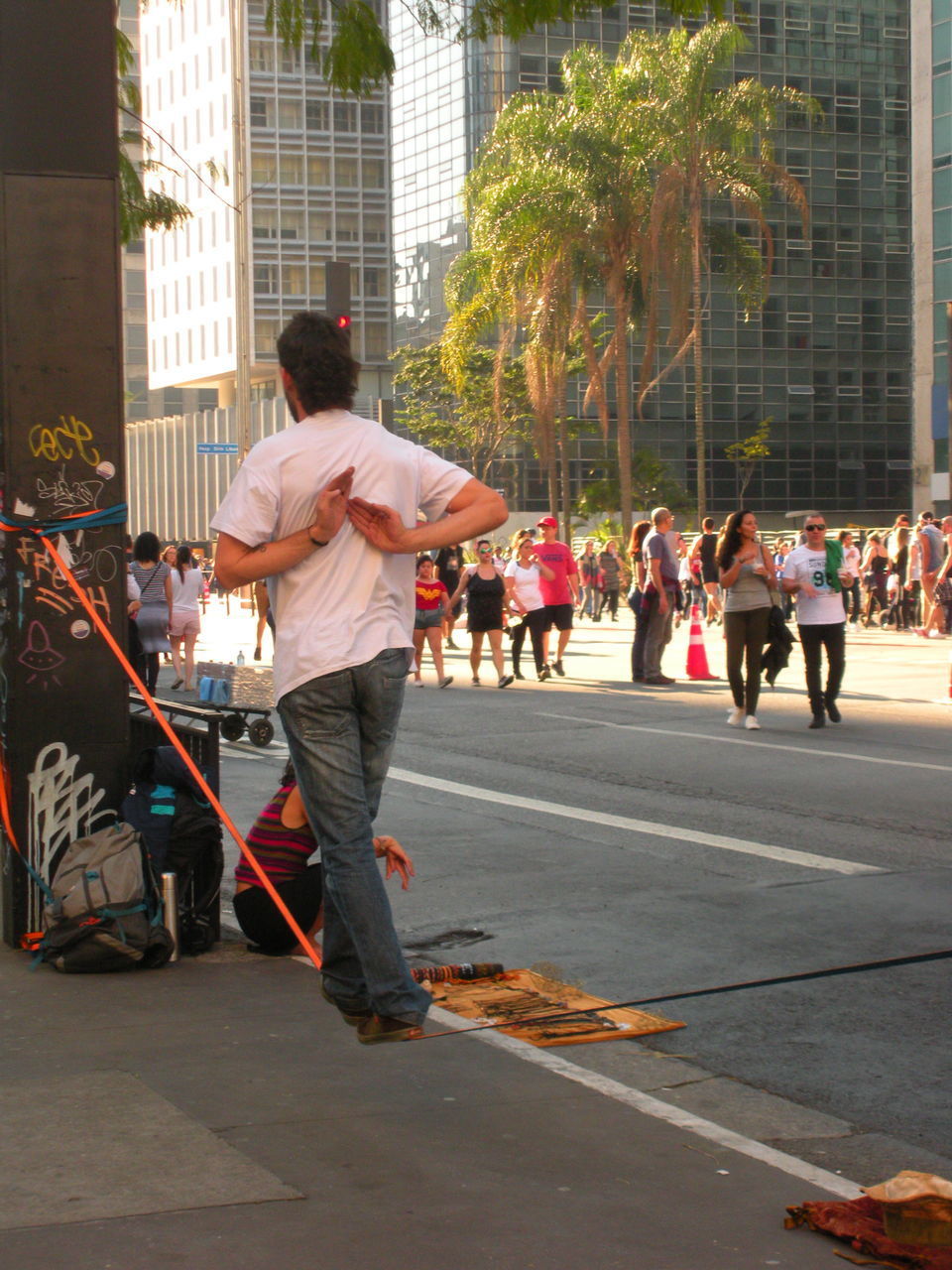 REAR VIEW OF PEOPLE ON STREET