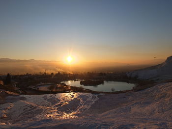 Scenic view of landscape against sky during sunset