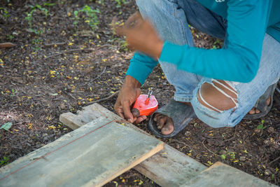 Low section of man working on field