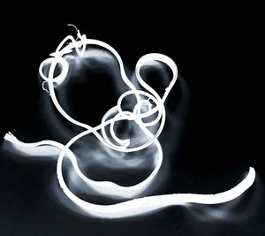 Close-up of electric lamp against black background